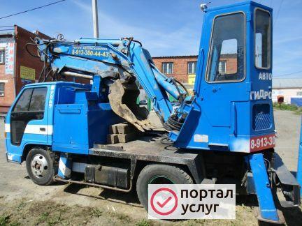 Фото Экскаватор с гидромолотом