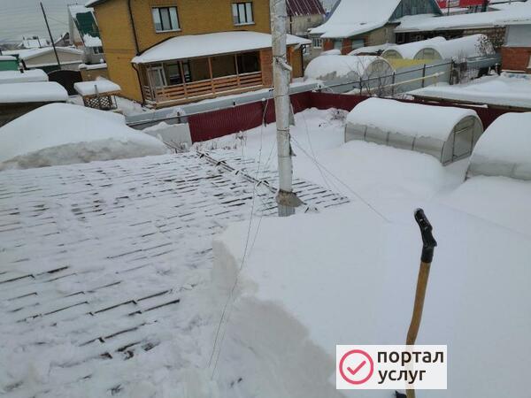 Фото Уборка снега с крыш