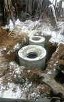 Копаем ямы трактором под канализацию и воду