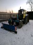Расчистка снега трактором